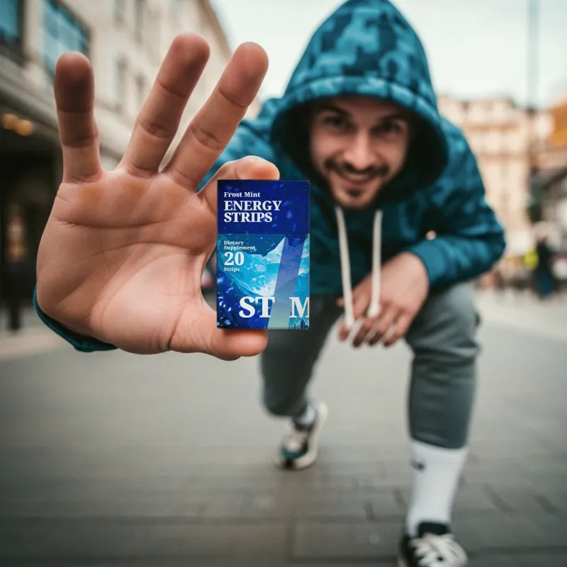 Man holding a pack of STIM Energy Strips